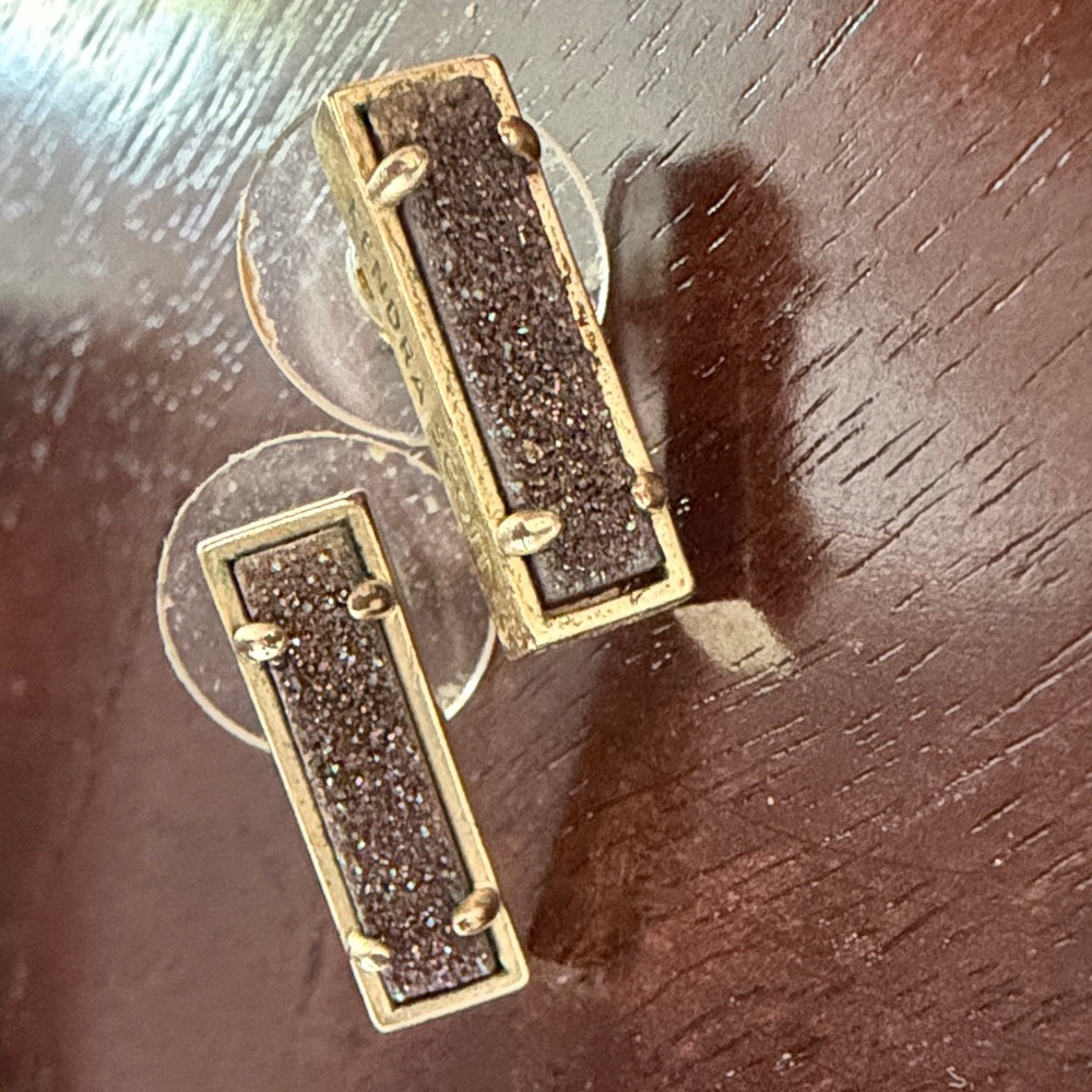 Kendra Scott lazy stud earrings with gold metallic frame and druzy stone inlay